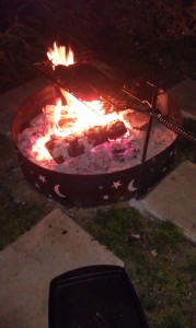 Finishing the ribs over the fire